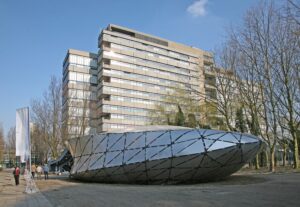 Floriade 2002, Web of North-Holland, Kas Oosterhuis, ONL, Octatube International, Siebrandus S. Wichers graduation project, freeform, space ship, UFO shaped, operable door, tuball system, protospace, Delft University of Technology, faculty of architecture, fire, prefabrication, steel structure, cut plates, different thicknesses, triangular cold bent cladding on brackets, alternative designs, pavilion.